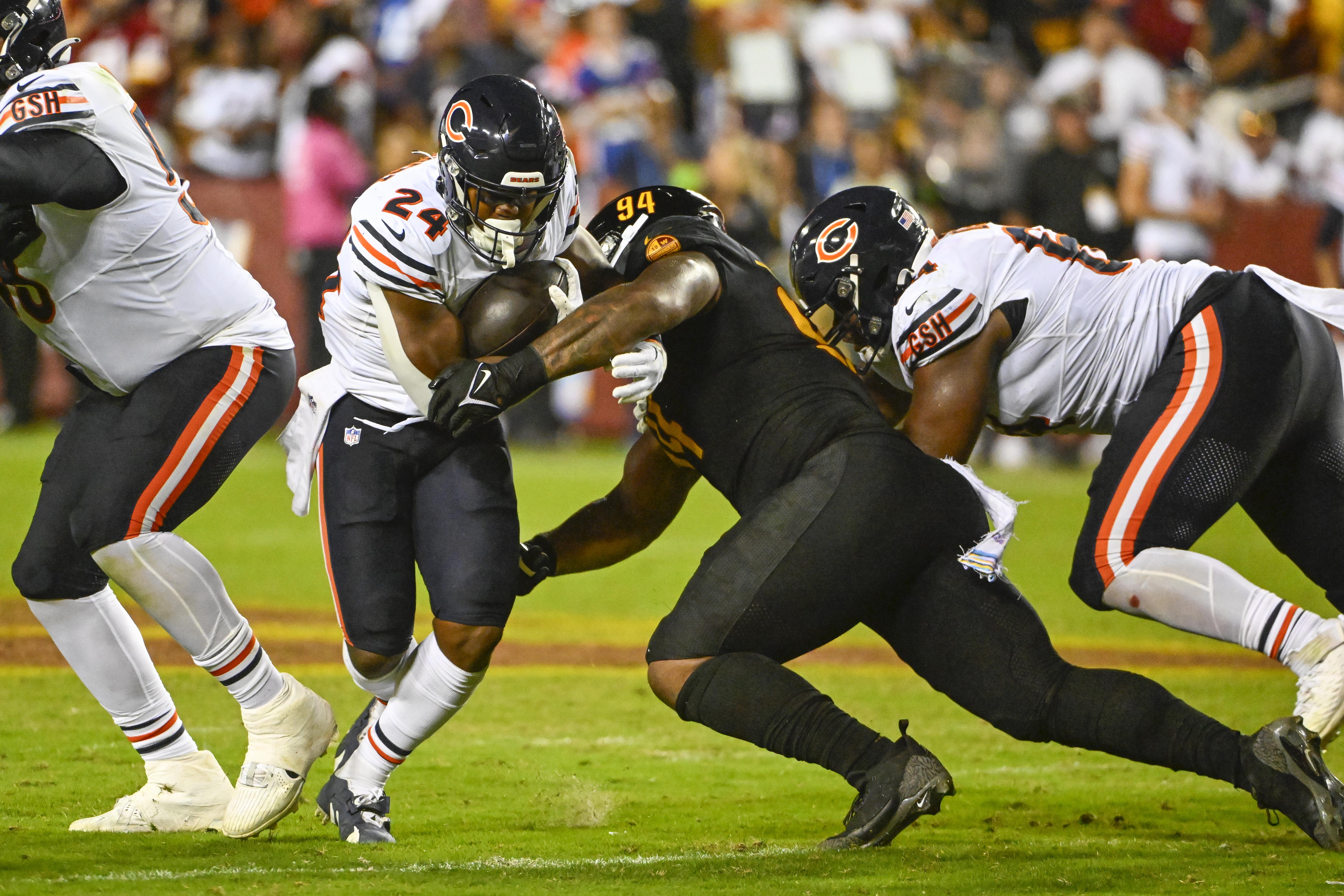 Washington Commanders defensive tackle Daron Payne and Chicago Bears running back Khalil Herbert